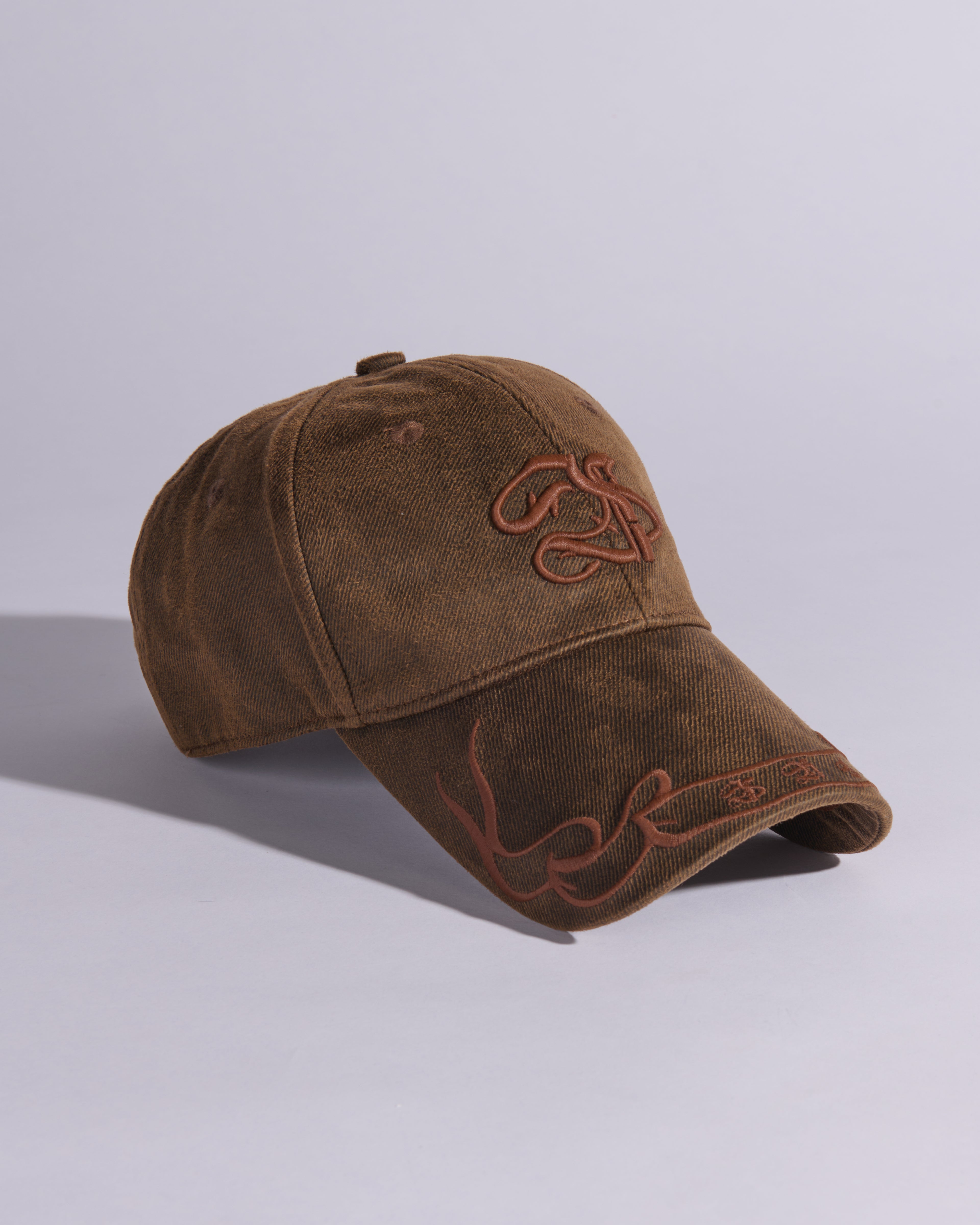 BANNERED WAXED COTTON BASEBALL CAP IN BURNT BROWN