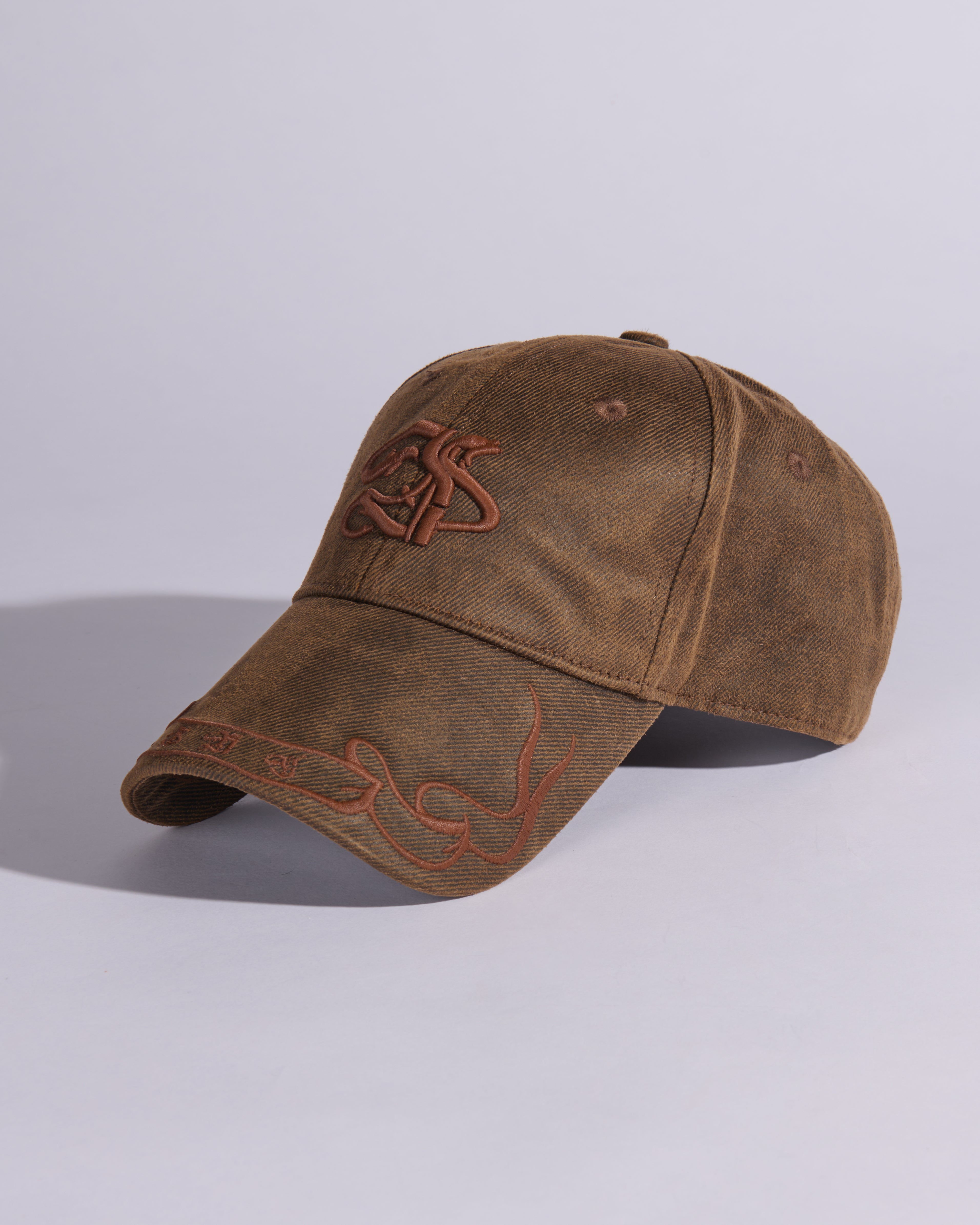 BANNERED WAXED COTTON BASEBALL CAP IN BURNT BROWN